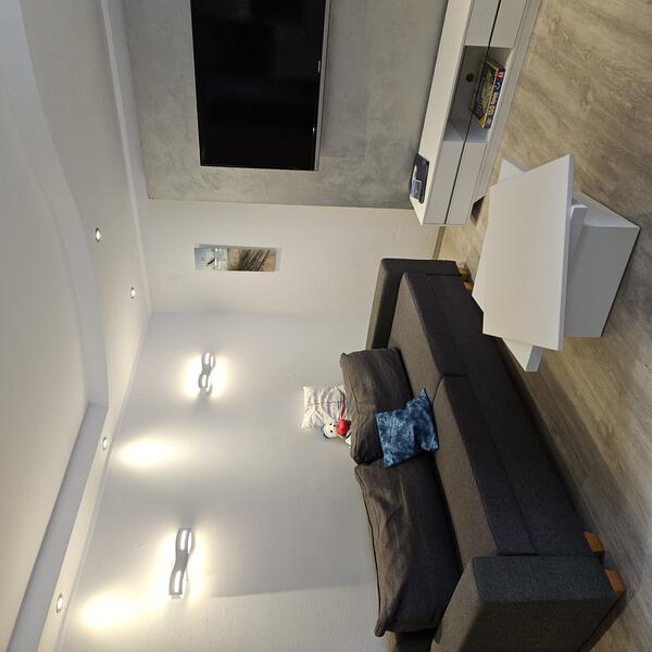 Wohnzimmer mit Schlafsofa