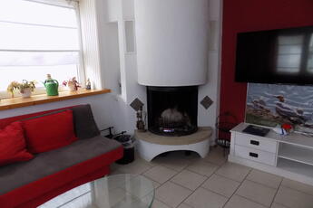 Ferienhaus Sweet Home Wohnzimmer mit Kamin